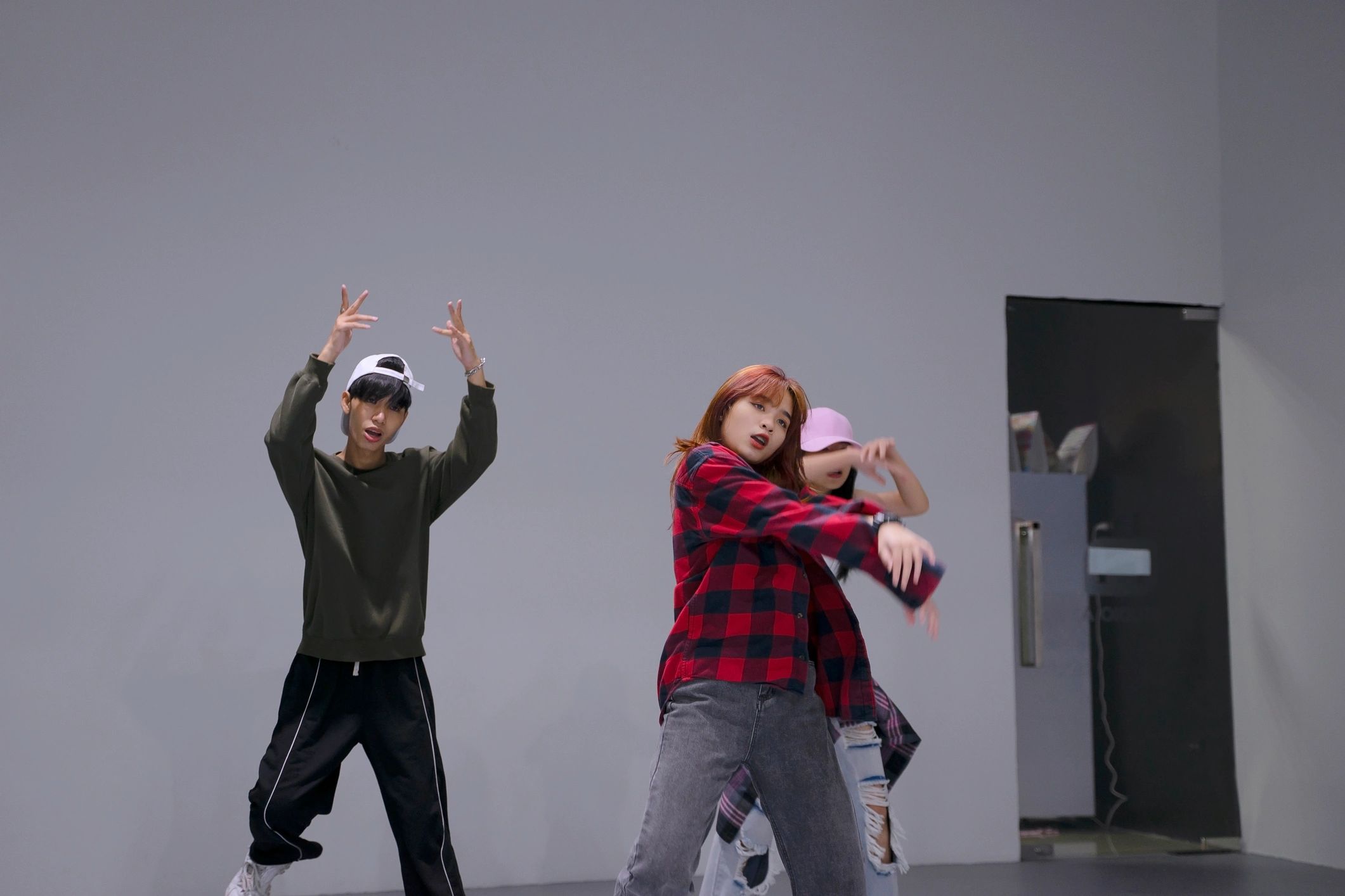 Teen dancers practicing together in a studio